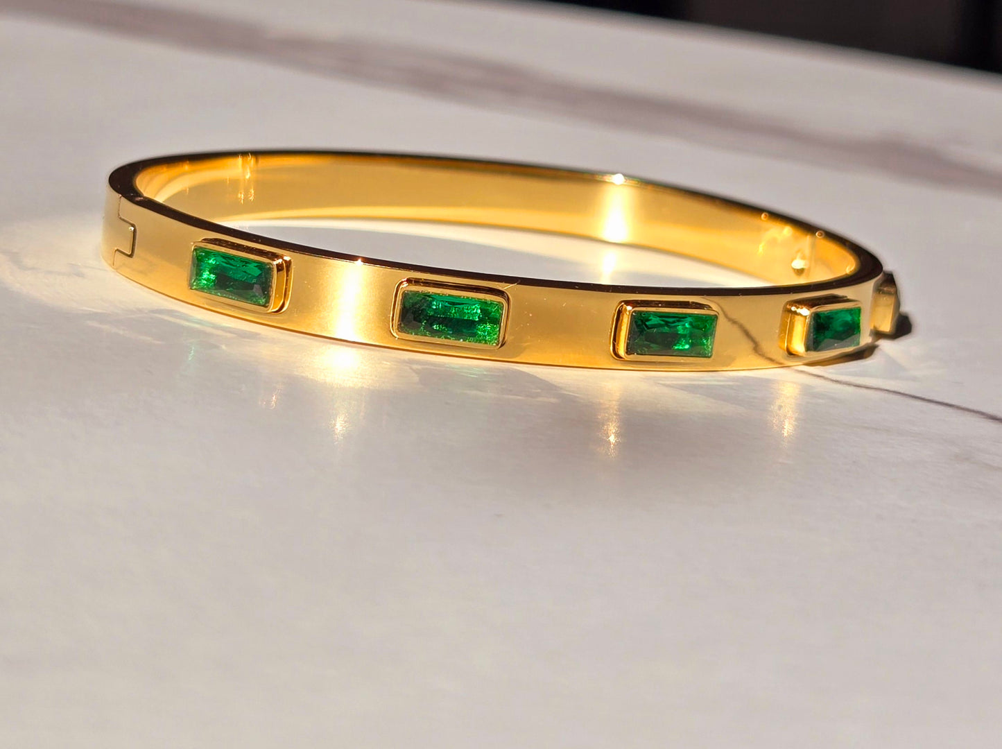 Emerald Elegance Gold Bangle